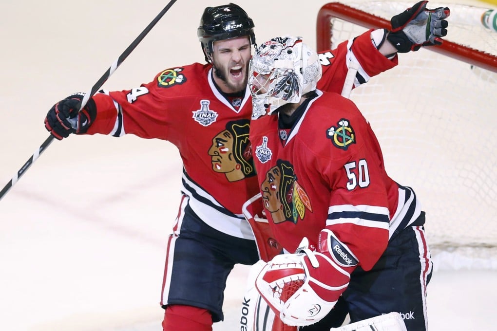 Chicago Blackhawks' Niklas Hjalmarsson (left) celebrates with goalie Corey Crawford after their win over the Boston Bruins in Game 5 of the Stanley Cup finals. Photo: Reuters