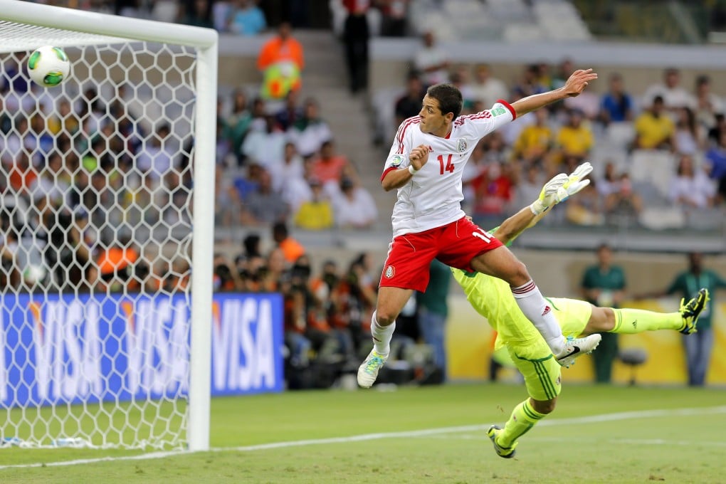 Javier Hernandez of Mexico scores his first goal against Japan, on Saturday. Photo: EPA