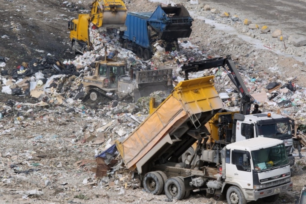A waste truck unloads at a landfill. Photo: Dickson Lee