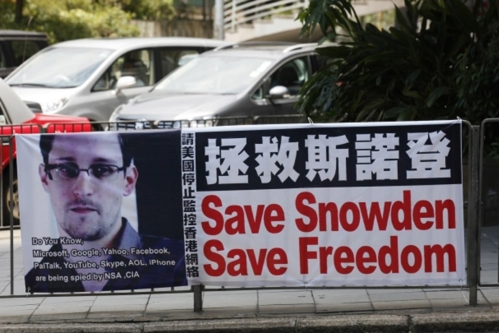 A banner supporting Edward Snowden is displayed at Central, Hong Kong's business district. Photo: AP