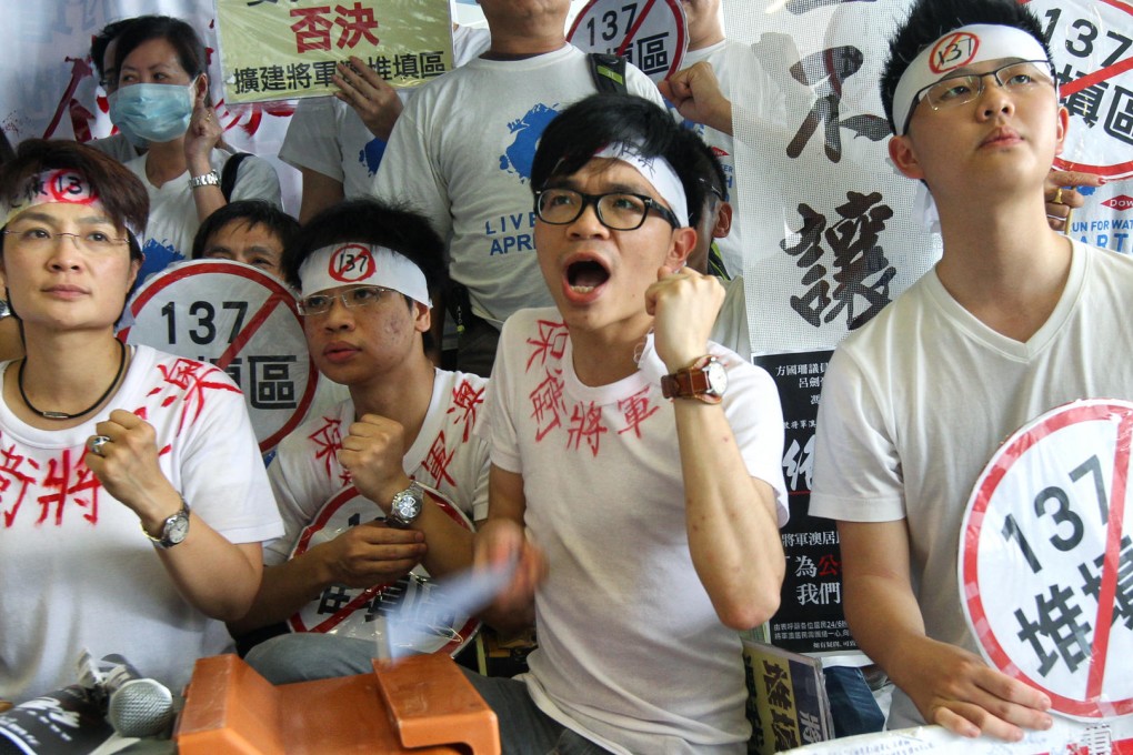 District councillor Christine Fong Kwok-shan (left) and residents protest outside Legco. Photo: David Wong