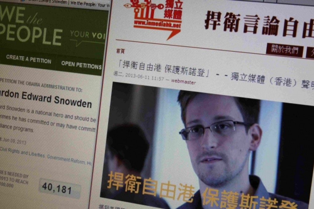 Statement by Hong Kong online media supporting Snowden displayed alongside White House website on computer screen in Hong Kong. Photo: Reuters