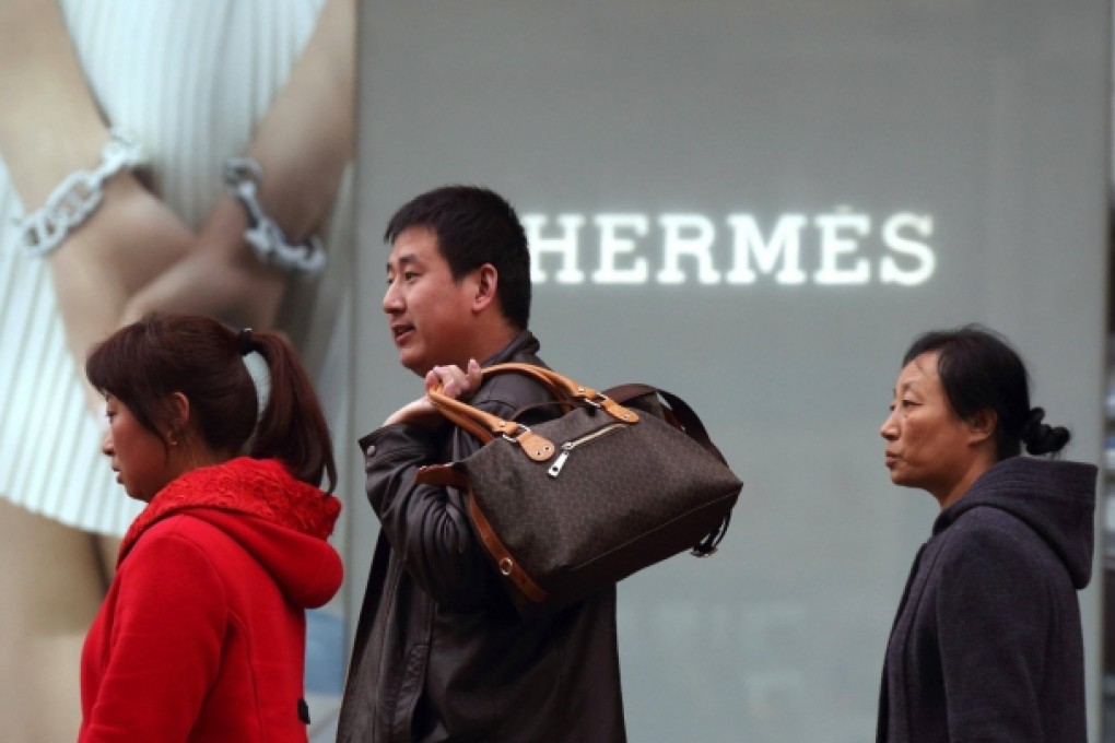 China's mega rich are not content with flash handbags and yachts. Now they actually buy the firms making the goods. Photo: Bloomberg