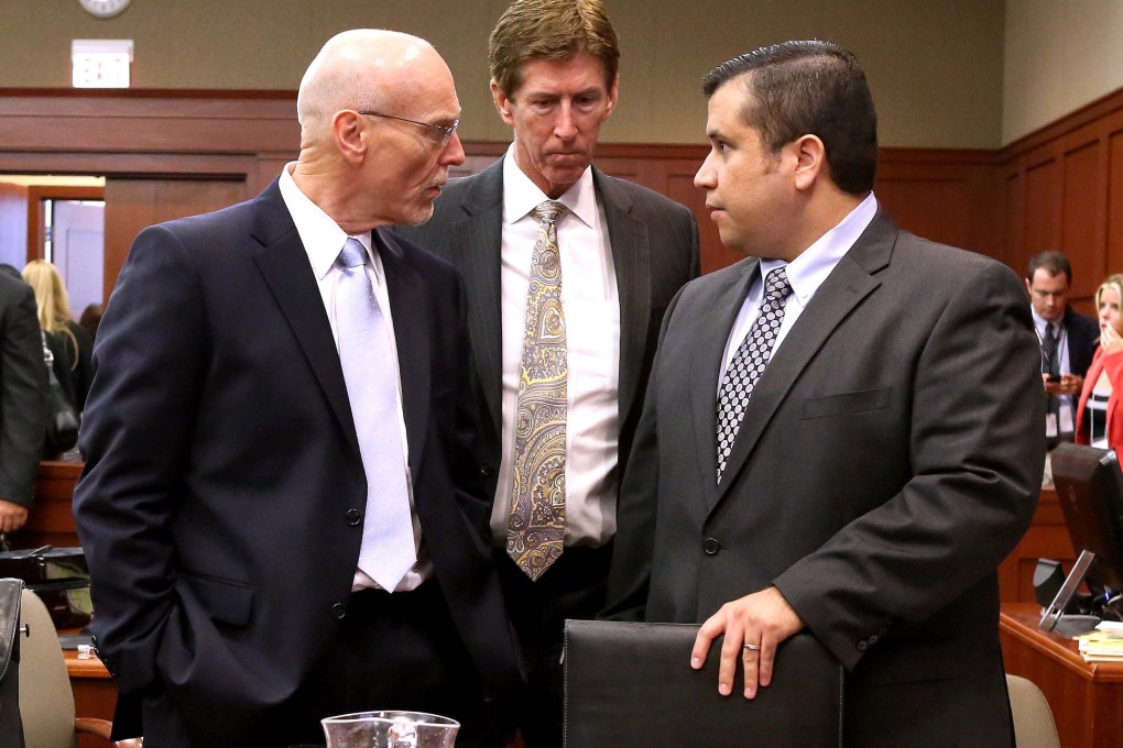 Co-counsel Don West (left) and Defence attorney Mark O'Mara (centre) talk with George Zimmerman during opening arguments in Seminole circuit court in Sanford in Florida. Photo: Reuters.