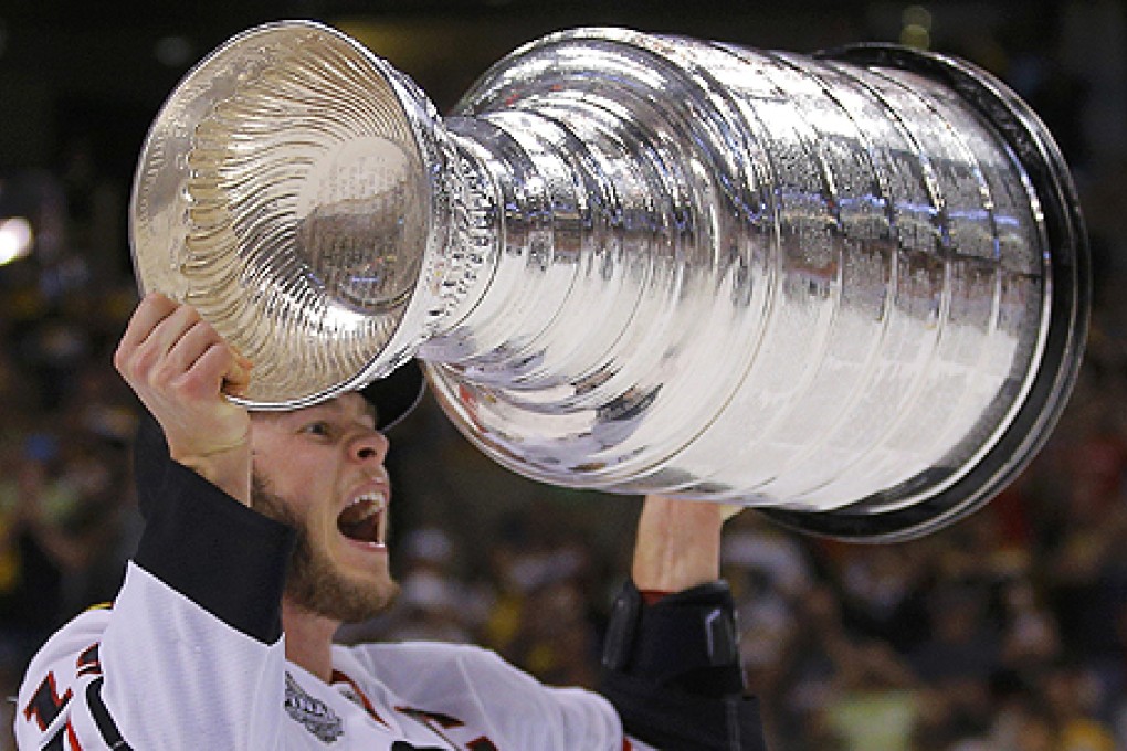 Chicago Blackhawks' Jonathan Toews celebrates with the Stanley Cup. Photo: Reuters