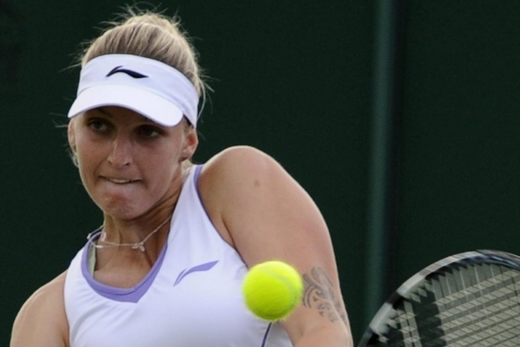 Czech player Karolina Pliskova returns to Russia's Nadia Petrova in their first-round match at the All England Club. Photo: EPA