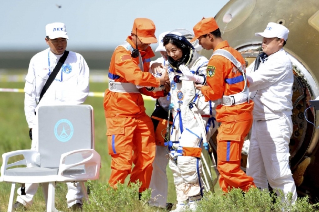 Chinese astronaut Wang Yaping emerges from the re-entry capsule on Wednesday. Photo: Xinhua