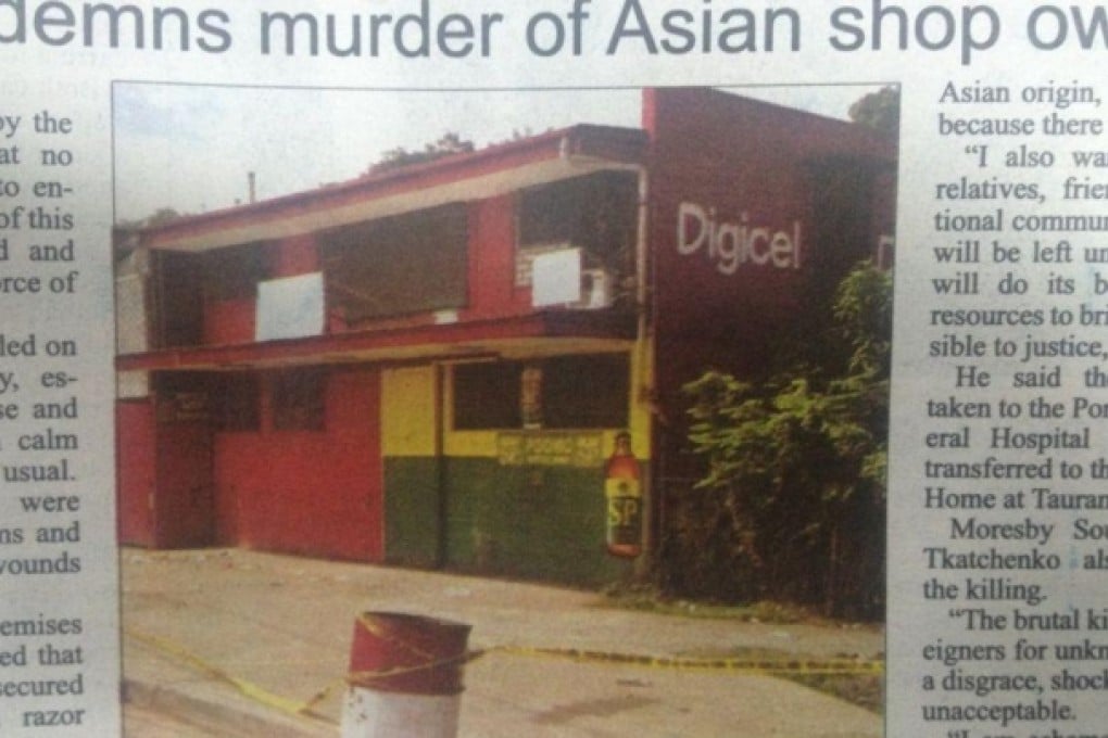 A local newspaper shows the store where the owner, his wife and two workers were murdered. Photo: SCMP