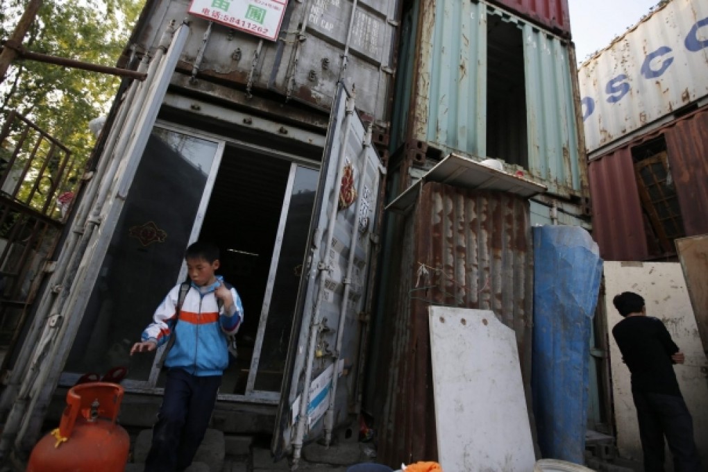 A migrant boy whose Shanghai family faces relocation. Photo: EPA