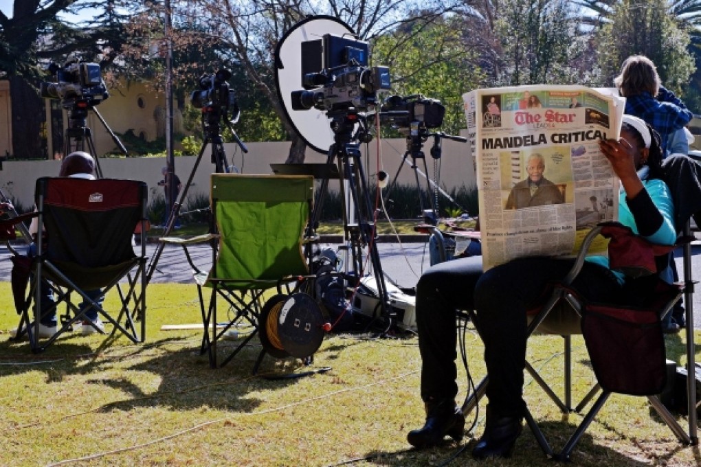 The media camped outside Mandela's home. Photo: AFP