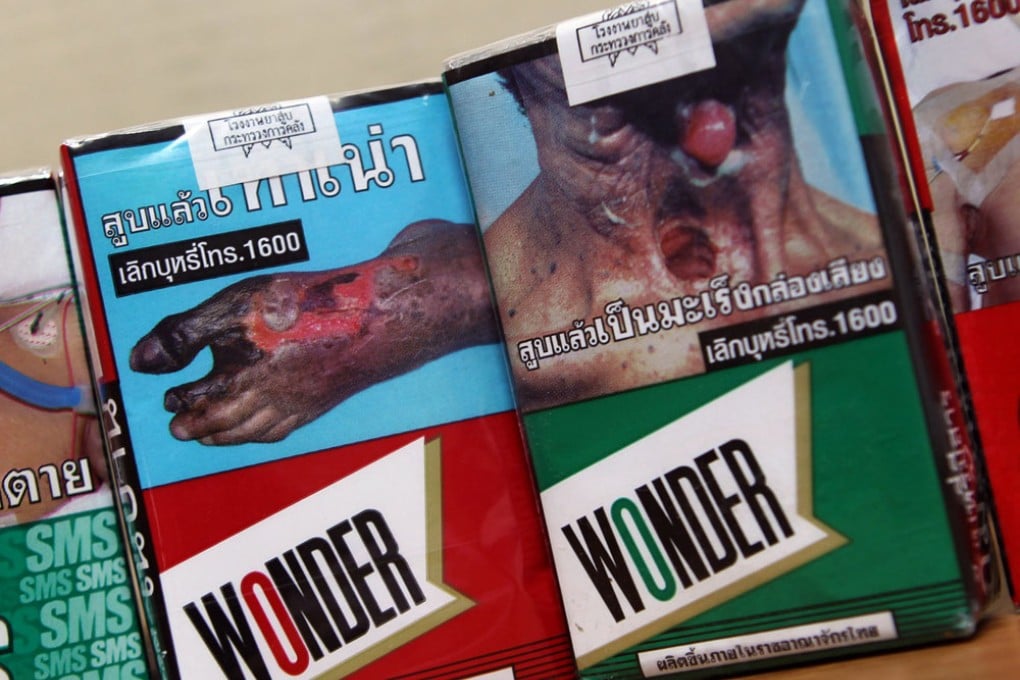 Thailand tobacco giant Philip Morris printed the warning signs on the cigarette packets. Photo: AP