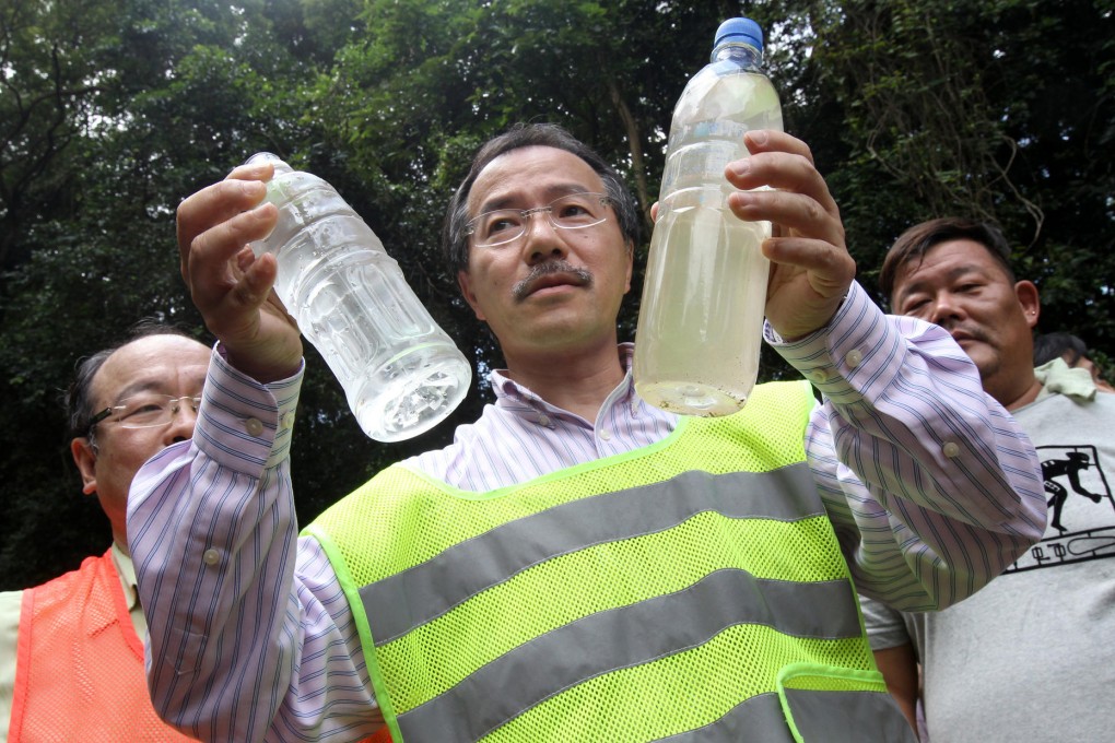 Fernando Cheung with water from the stream. Photo: David Wong