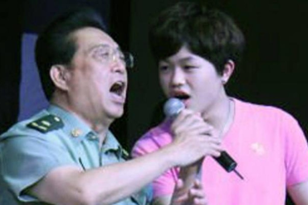 Famous PLA singer Li Shuangjiang (left) and his son. Photo: SCMP