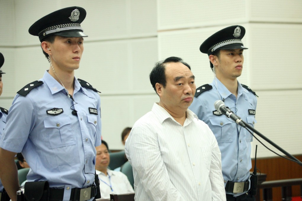 Lei Zhengfu, middle, the Chongqing official involved in a sensational sex tape scandal on trial in Chongqing. Photo: Xinhua