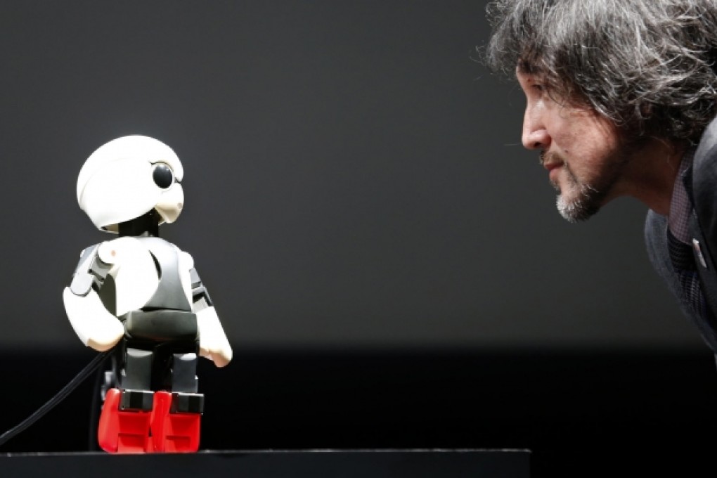 Kirobo chats with a designer at its media show. Photo: AP