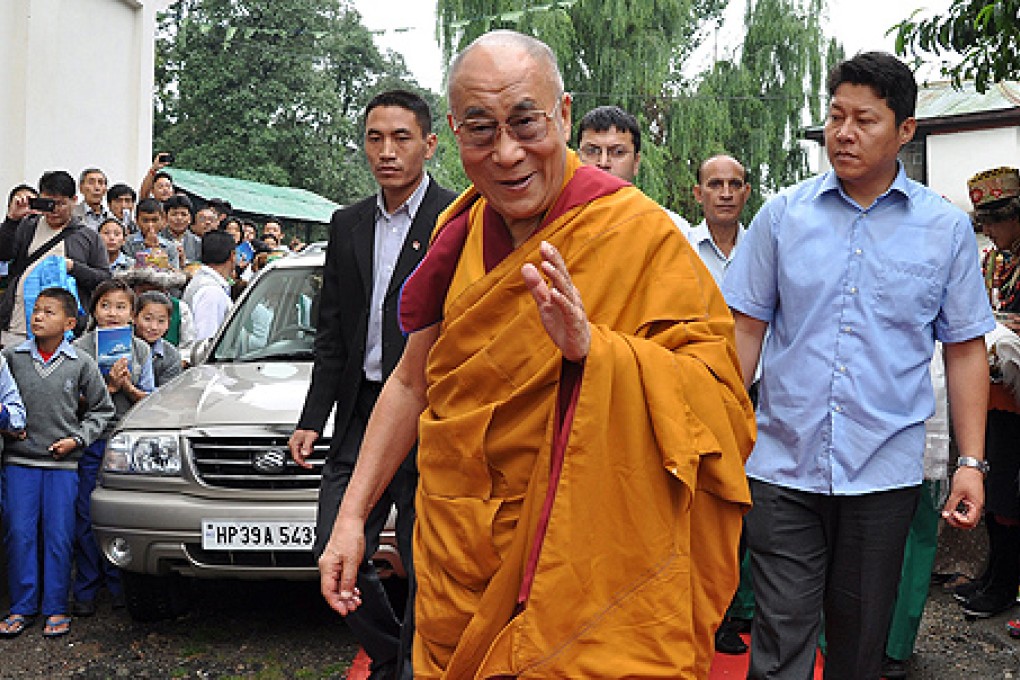 Dalai Lama arrives at a village school in Dharamsala, India, to teach a lesson to Tibetan youth on Thursday. Photo: EPA