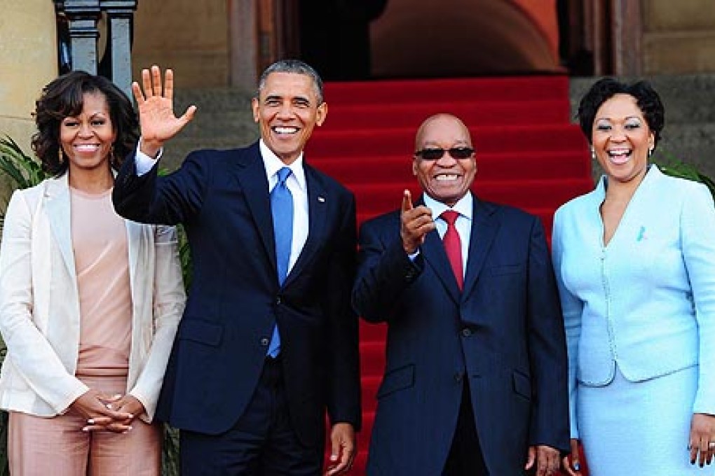 (From left) US first lady Michelle Obama, President Barack Obama, and South African President Jacob Zuma and wife Tobeka Zuma. Photo: EPA