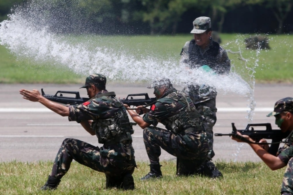 PLA soldiers perform drills at their Shek Kong barracks. Photo: Sam Tsang