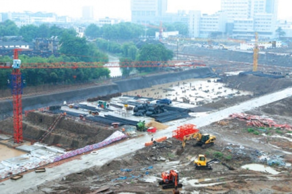Work is carried out on a Zhenjiang property development three years ago at the site of ancient grain warehouses. Photo: SCMP