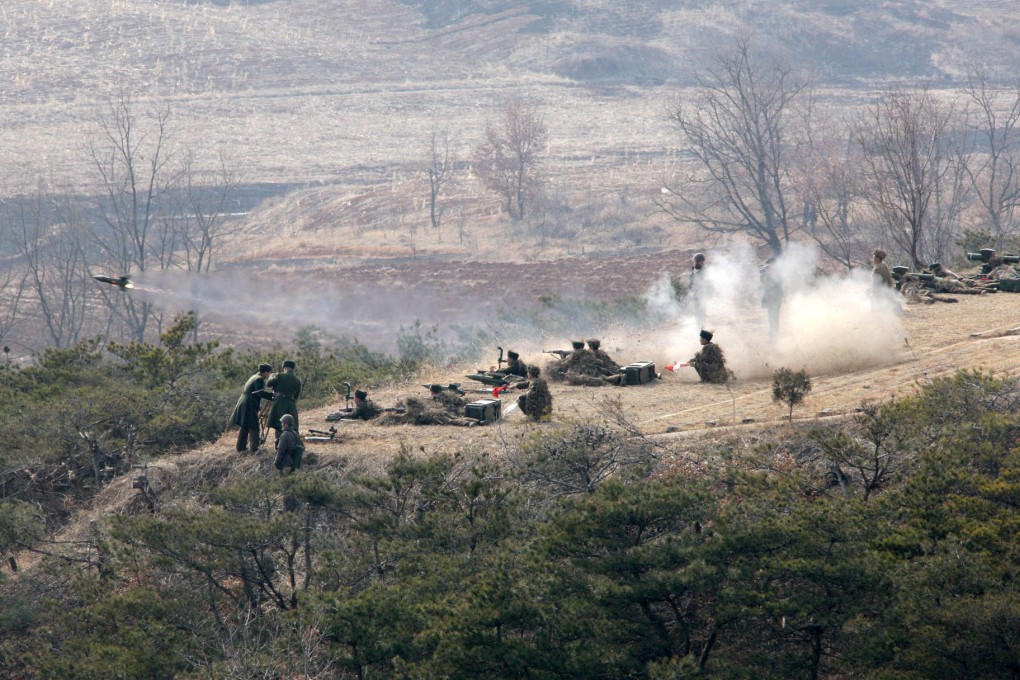 Soldiers of a Korean People's Army artillery unit fire a rocket during a drill in February 2013. Photo: AP
