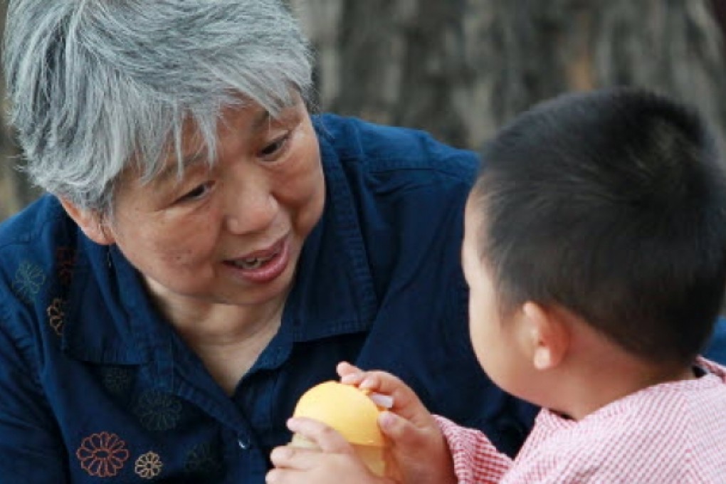 An old woman and her grandson in Beihai Park in Beijing. Photo:Simon Song