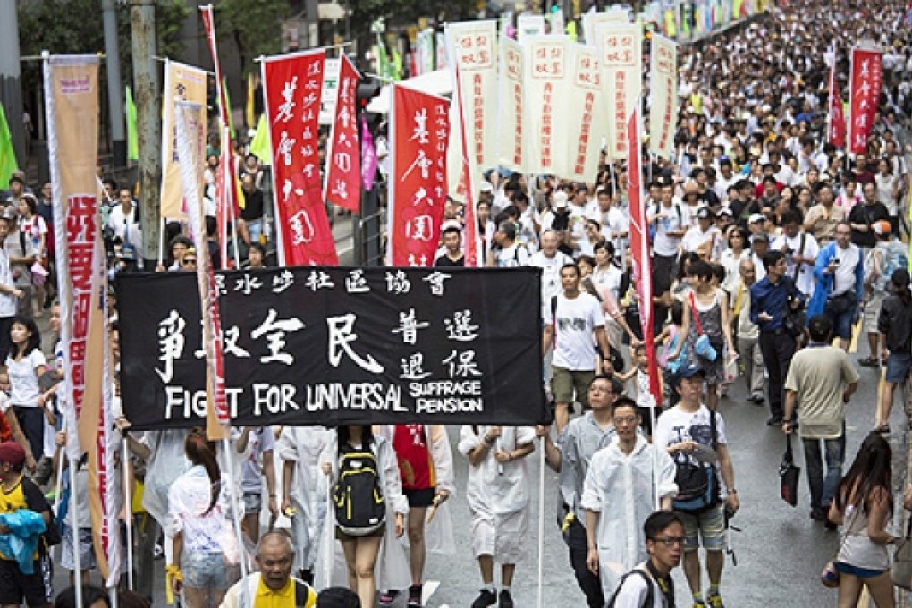 Hundreds of thousands of protesters joined the annual July 1 rally from Victoria Park to Central. Photo: EPA