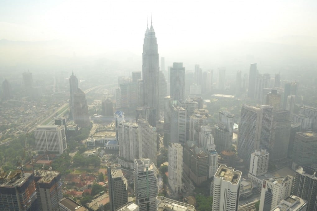 Kuala Lumpur skyline is seen covered by haze. Fires in Indonesia have blanketed Singapore and Malaysia in thick smog. Photo: AFP