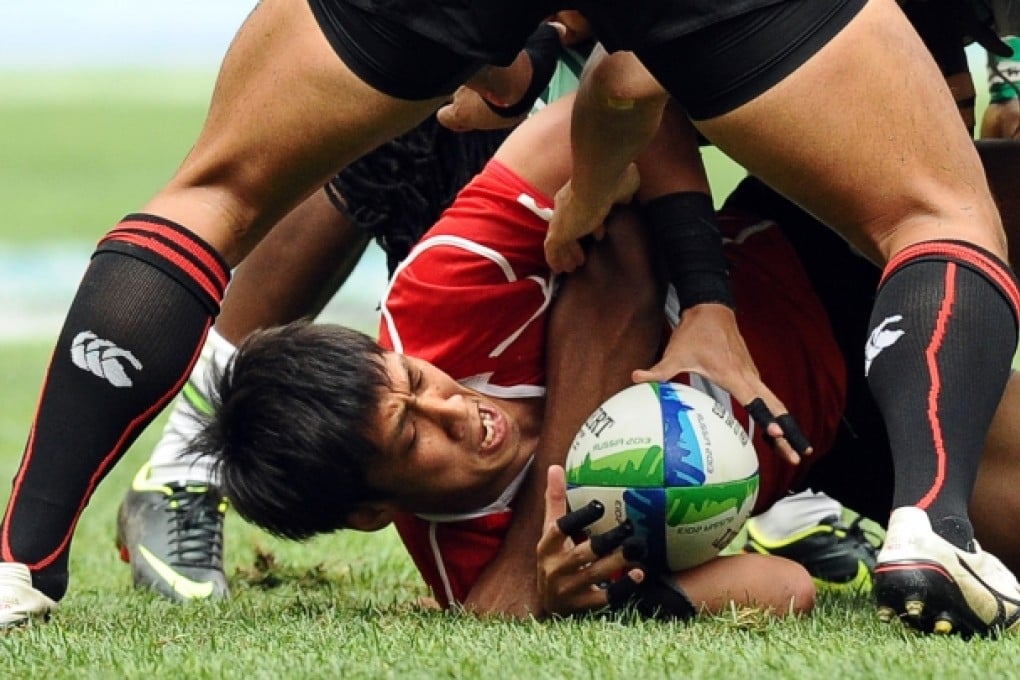 Japan captain Katsuyuki Sakai (centre) during their group stage match with South Africa. Photo: AFP