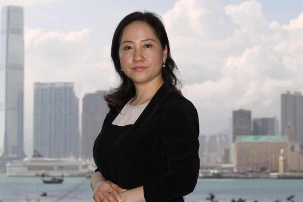 Angel Law, head of Knight Frank's new luxury residential department, in her office in Wan Chai. She says prices will drop by about 5 per cent this year. Photo: Edward Wong