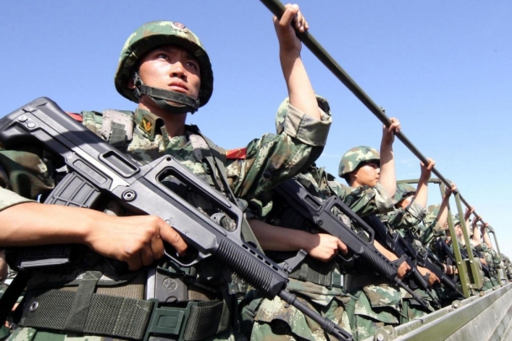 An anti-terrorism force including police and armed police attend an exercise in Hami, Xinjiang, yesterday. Photo: AFP