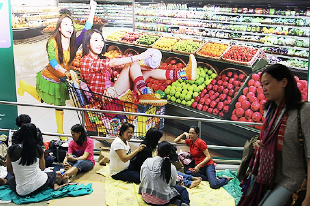 Domestic workers on a day off in Central. Photo: Felix Wong