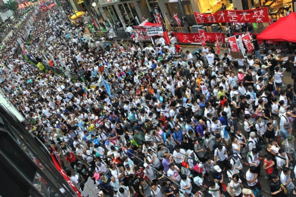 Marchers swamp Hennessy Road in Causeway Bay. Police later opened the eastbound lanes following a confrontation with protesters outside Sogo. Organisers claimed police broke an agreement on policing of the march. Photo: Felix Wong