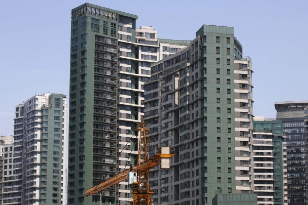 Construction work at a residential complex in Beijing, possibly fuelling further increases in home prices. Photo: Reuters