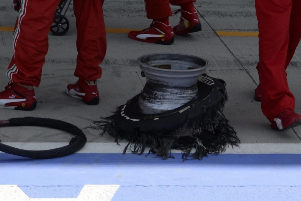 Felipe Massa's punctured tyre on display during the British Grand Prix at the Silverstone circuit. Photo: EPA