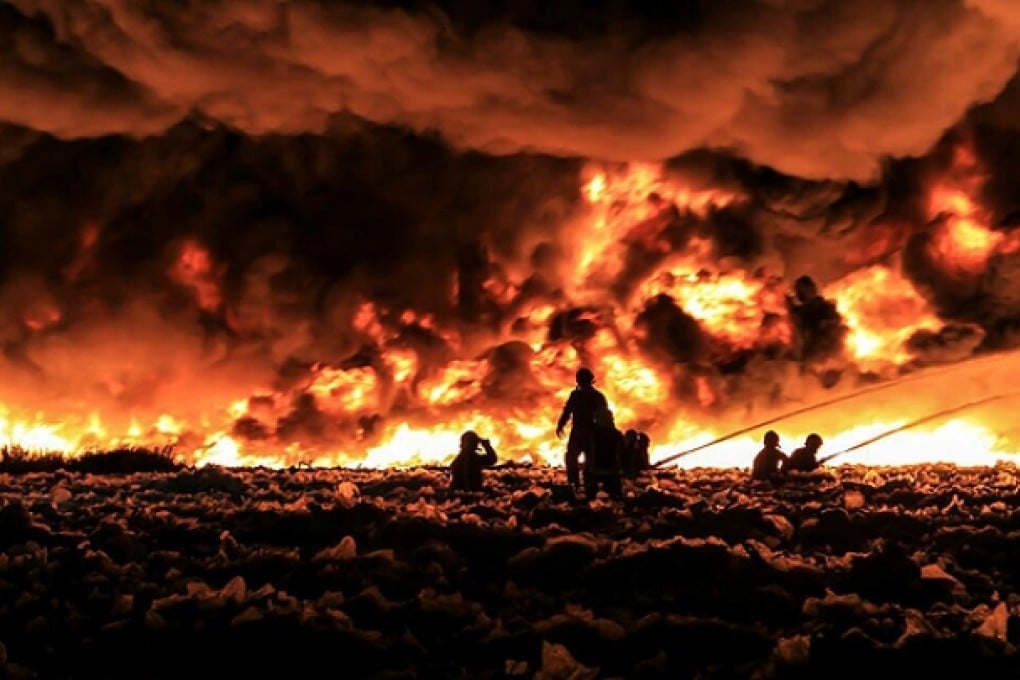 Fire fighters tackle a large blaze at a recycling centre in Smethwick. Photo: Reuters