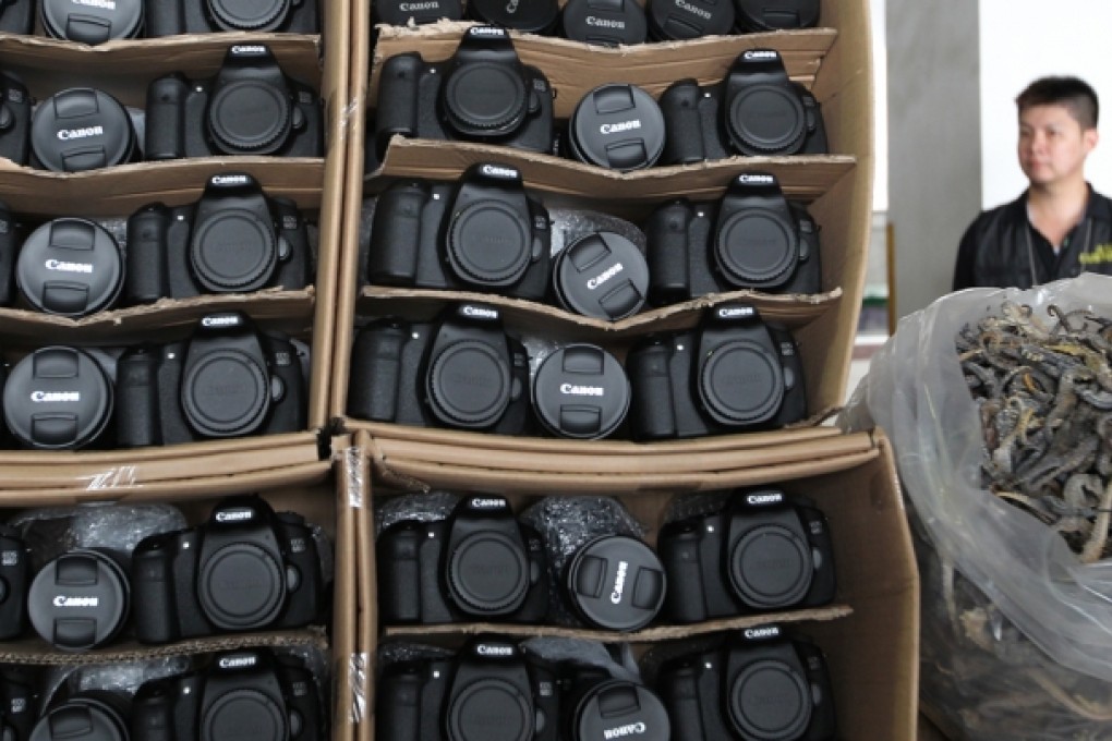 Cameras, lens and dried sea horse seized by the Customs and Excise Department. Photo: Nora Tam