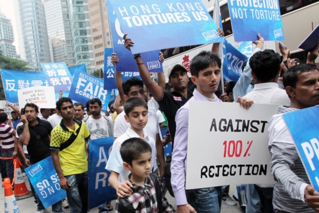 Refugee support group Vision First marches to protest against Immigration Department's 100 percent rejection of torture claims on April 27, 2013. Photo: May Tse