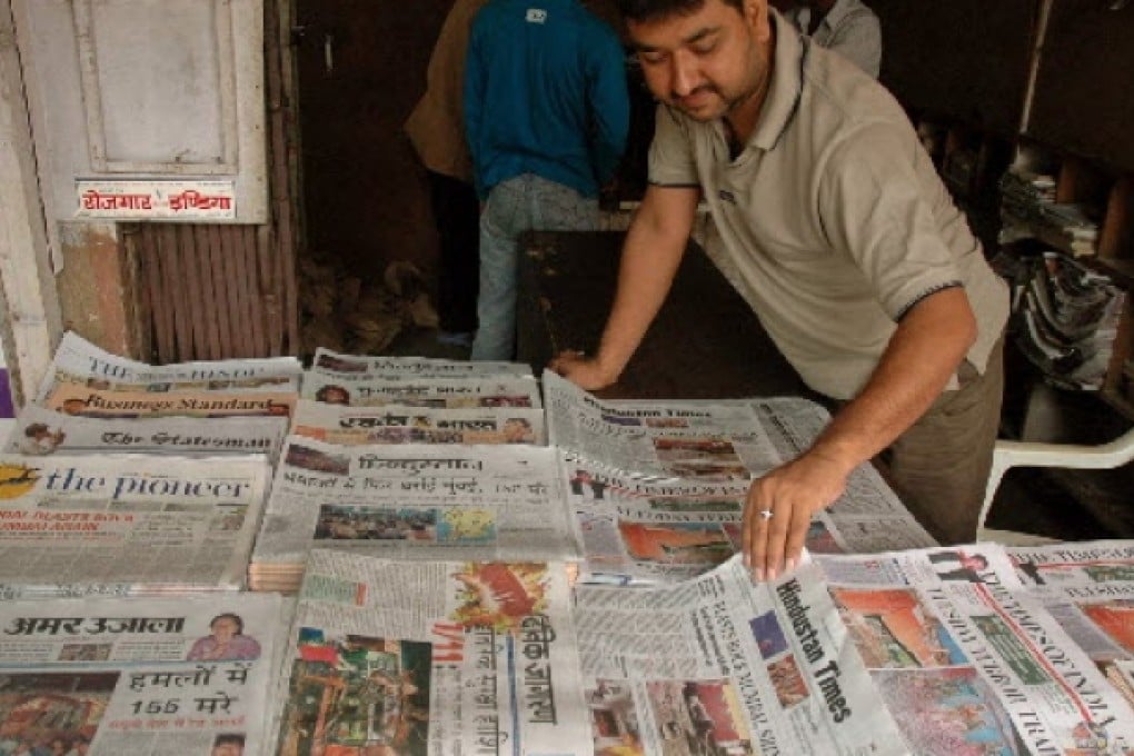 Copies of The Times of India (front, right corner) on a newspaper stand. Photo: Reuters
