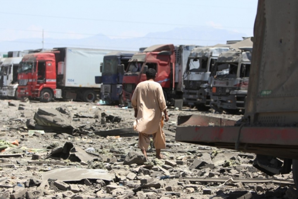 An Afghan man walks at the site of a suicide attack in Kabul. Photo: Xinhua