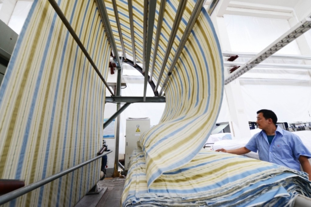 A worker at a textile factory in Zouping County, in east China's Shandong province. Photo: Xinhua