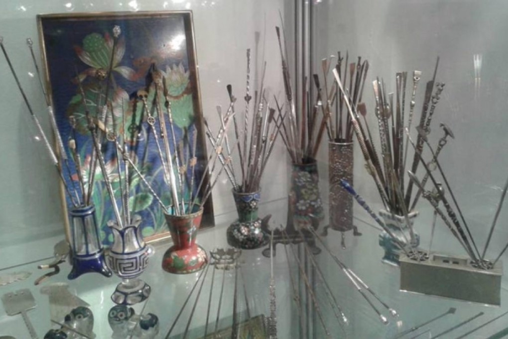 Pipe dreams: ornate opium pipes on display at Maggs, in Mayfair, London.