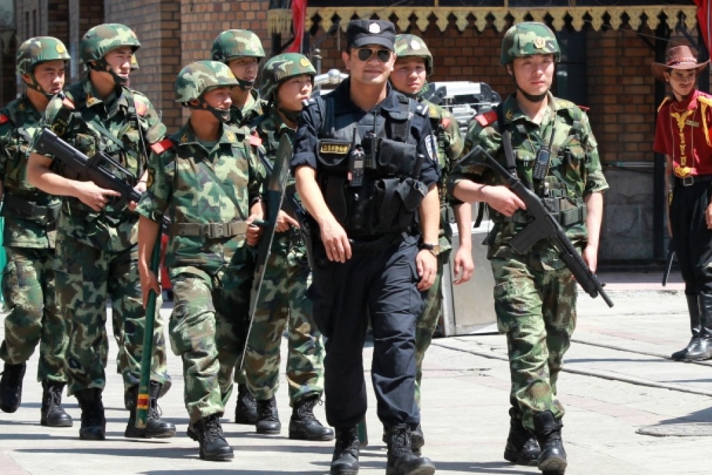 People's Armed Police officers on patrol in Urumqi yesterday, ahead of the fourth anniversary of the deadly 2009 riots. Photo: Simon Song