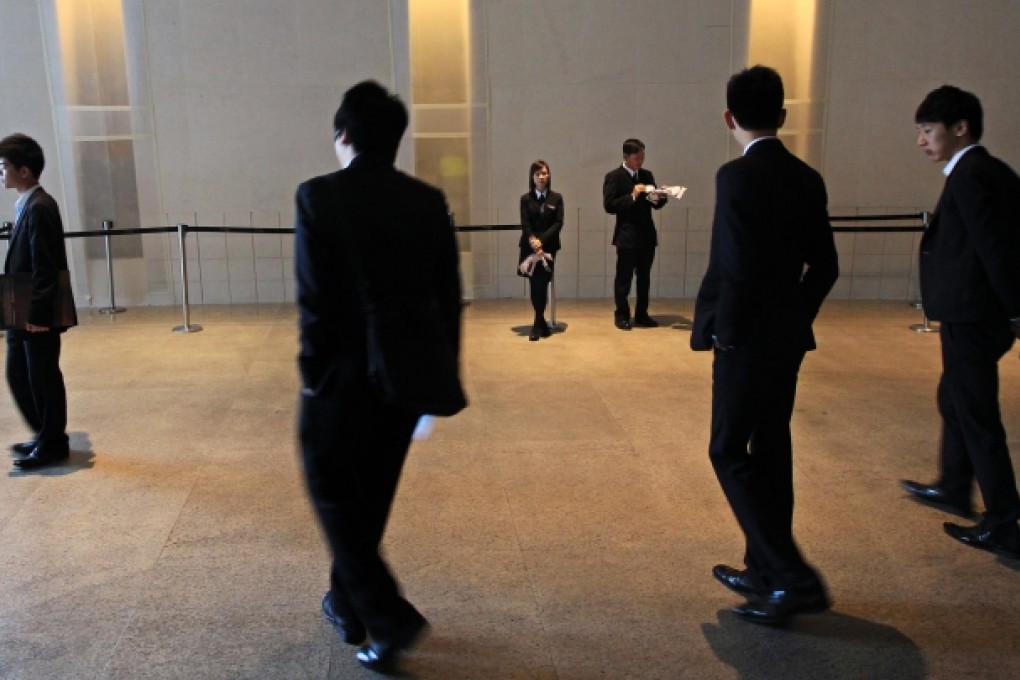 Real estate agents wait for customers. The industry says government measures to cool the property market may force some agents out of the industry as transaction volumes fall. Photo: Jonathan Wong