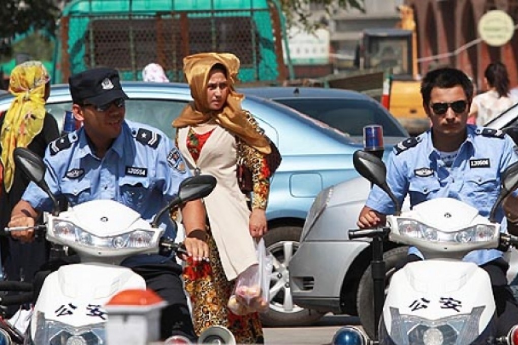 Policemen patrol the streets in Urumqi, Xinjiang Uygur Autonomous Region on Thursday. Photo: Simon Song