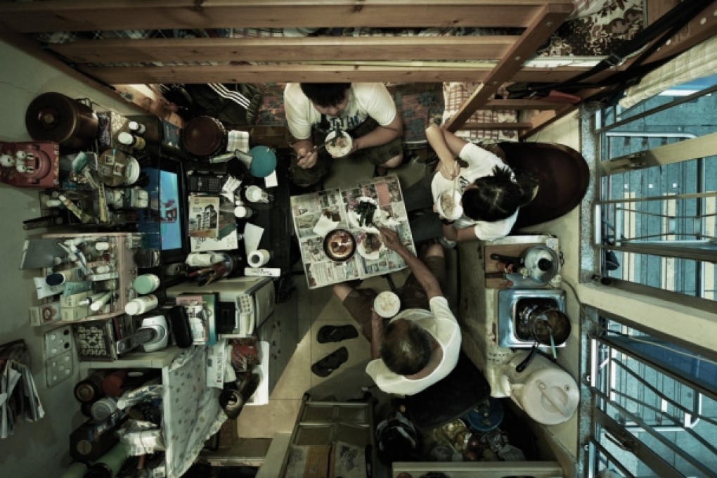 Poor people in Hong Kong cramped into tiny room, often in subdivided flat.