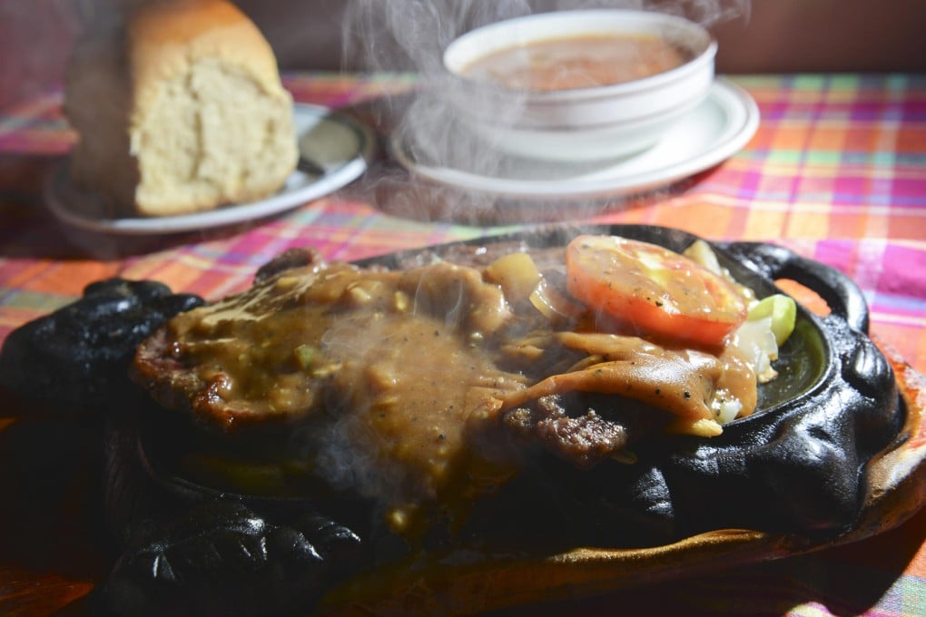 Lee Yi-ling and her husband Woo Bo-keung (below) have been serving steak since the 1970s. Photos: Thomas Yau