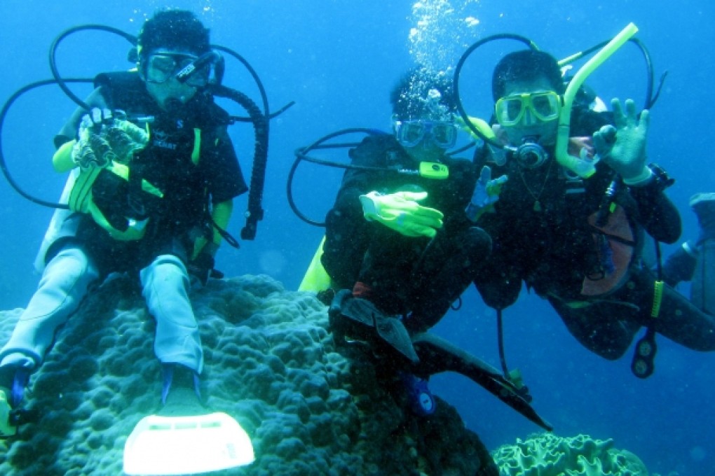 Tony Lit (right) bonds with his sons on one of many diving expeditions.
