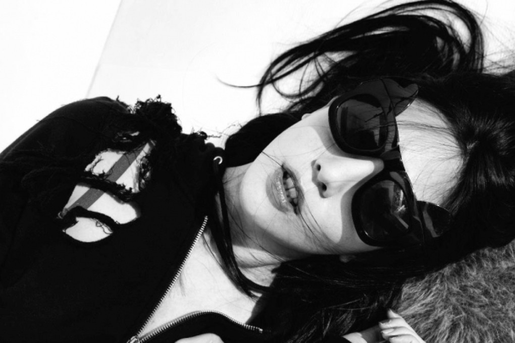 René Chu in a pair of Revé's Make Me Meow glasses with removable cat's ears. Photos: Marco Chow