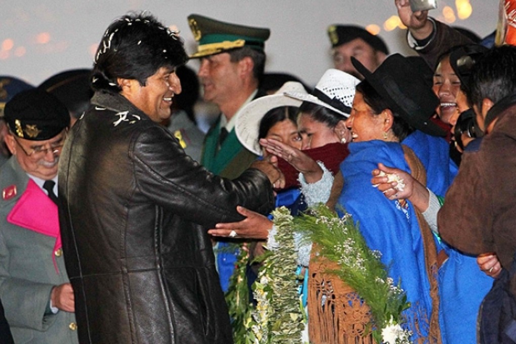 Bolivia's President Evo Morales recieved a warm welcome on his arrival home at El Alto airport in La Paz. Photo: EPA