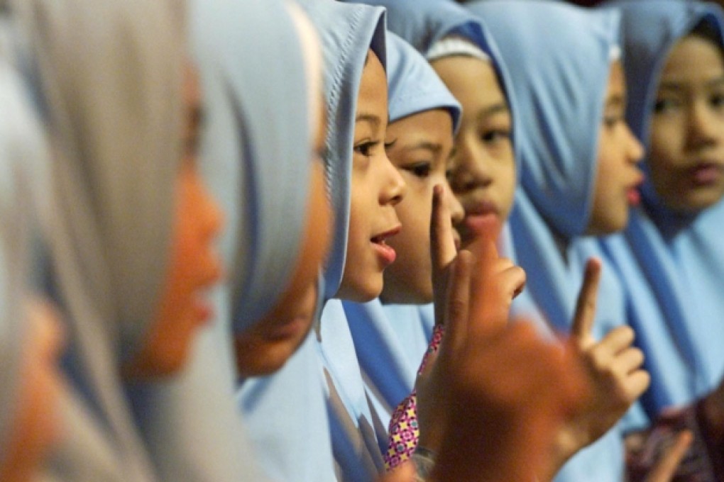 A bill allowing parent to convert children to religion without consent of partner triggered widespread criticism in Malaysia. Photo: Reuters